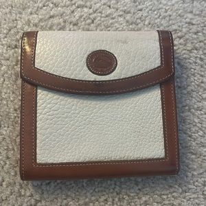 Dooney and Bourke vintage wallet. Plastic inside is cracked.